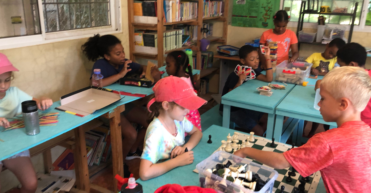 Children playing chess and other board games