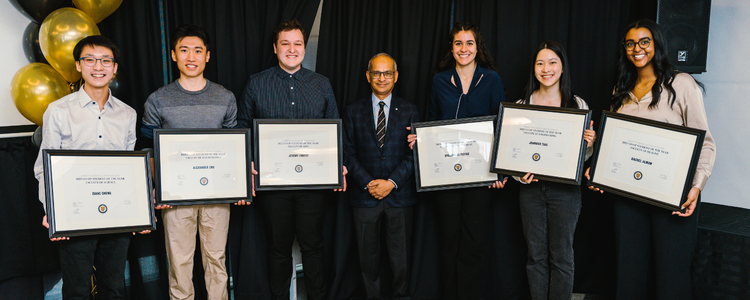 Group of six co-op students receiving their plaques from president vivek goel at the award ceremony