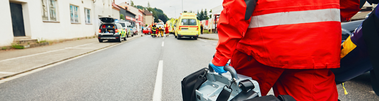 Emergency worker walking towards and accident