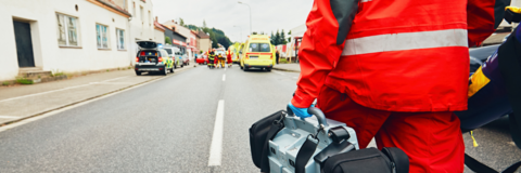 Emergency worker walking towards and accident