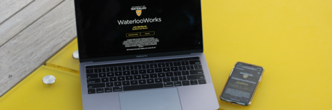 Laptop and phone with WaterlooWorks on it.