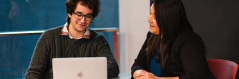 Student having conversation with advisor.