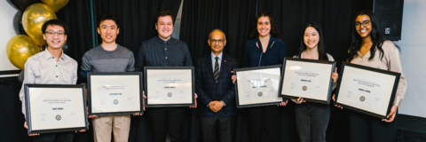 Group of six co-op students receiving their plaques from president vivek goel at the award ceremony