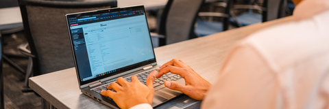 Student typing on laptop in WaterlooWorks
