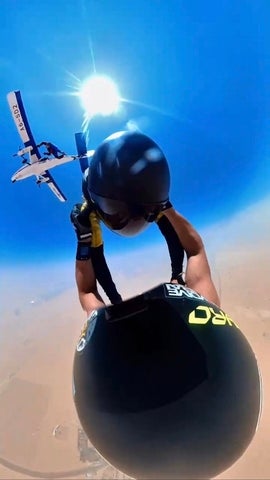 Adam Kafi skydiving off a plane 