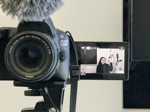 Ameera Khan posing in the viewfinder of a camera