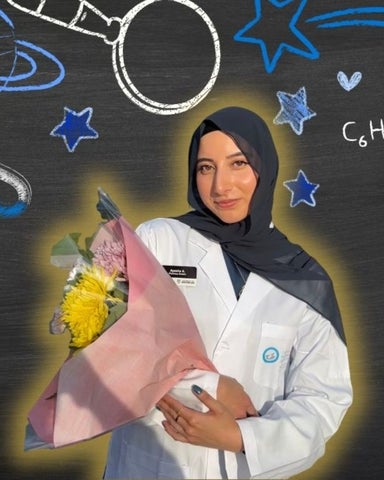 Ayesha Amanullah smiling/posing in front of science related icons