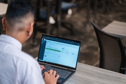 Student looking at laptop with waterlooworks open