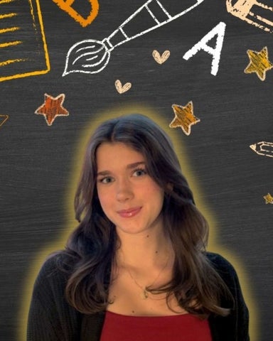 Chantelle Theirry smiling/posing in front of arts related icons 