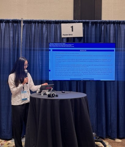 Christina Yang hosting a presentation