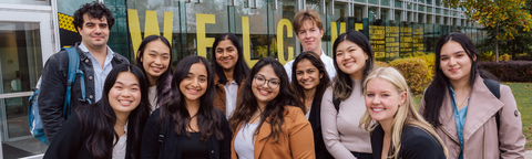Group of co-ops students smiling outside the tatham centre