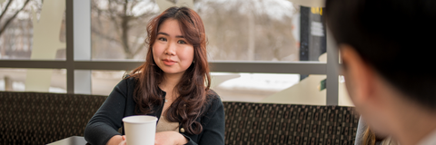 Student having a coffee chat with an employer