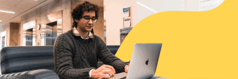 Co-op Student on computer smiling doing a mock interview