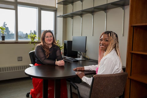 student speaking to co-op counsellor in office