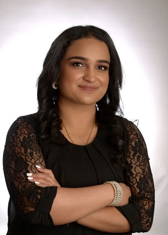 Hamisha Ramesh smiling and posing