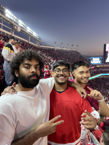 Dev Shah smiling and posing with friends