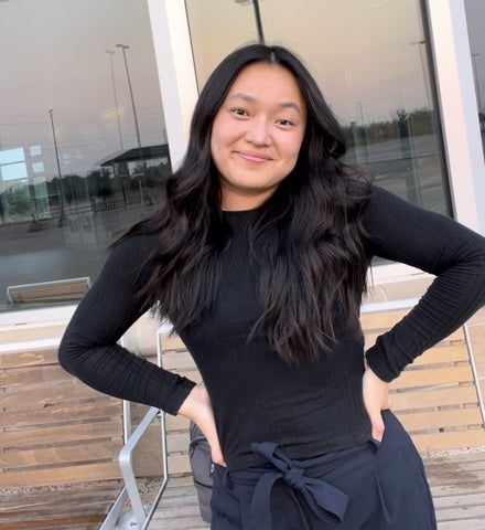 Emily Fitzgerald posing in front of a window