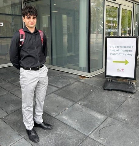 Aiden Sarrafzadeh posing in front of Women's College Hospital