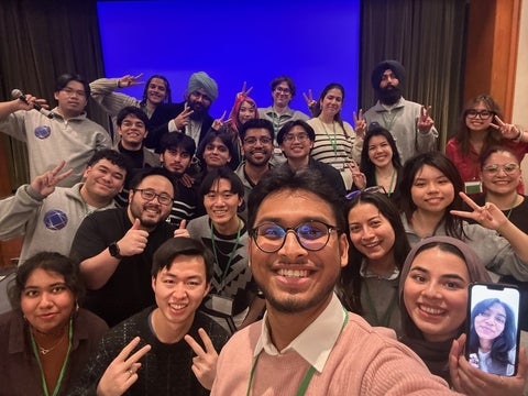 Franklin Ramirez smiling with a group of people
