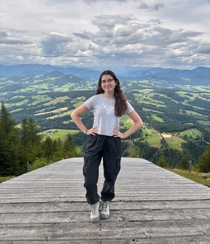 Francesca Girmenia posing in front of Schöckl (TU Graz's local mountain) 