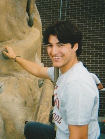 Martin Bissonnette posing in front of a rock climbing structure