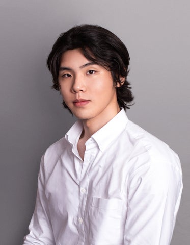 Hyeseong posing in a white collared shirt