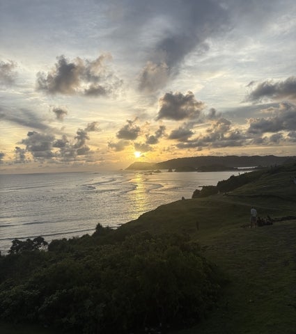 Sun setting over a coastal shoreline in Indonesia