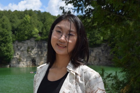 Giang Tran smiling outside