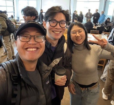 Giang Tran posing with two other people