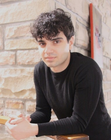 Aiden Sarrafzadeh posing