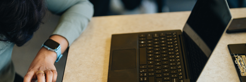 laptop and notebook on table