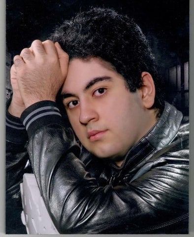 Danial Ghamari posing in a leather jacket