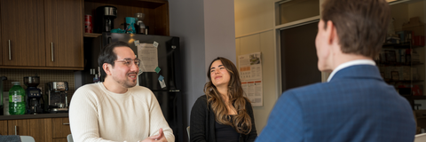 Co-op student talking to two employees