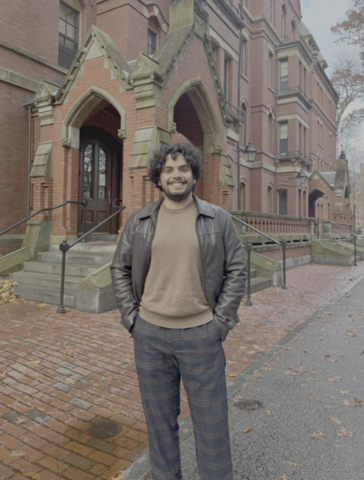 Vinayak Bector posing in front of Harvard University