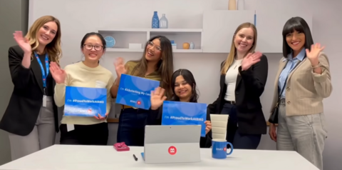 Karen Xie waving with BMO employees