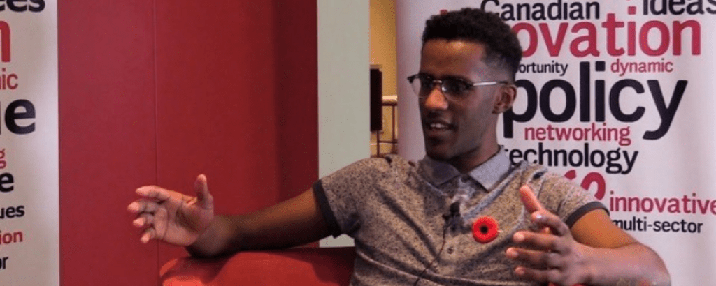 University of Waterloo Software Engineering co-op student, Joseph Tafese, sitting on a chair and talking