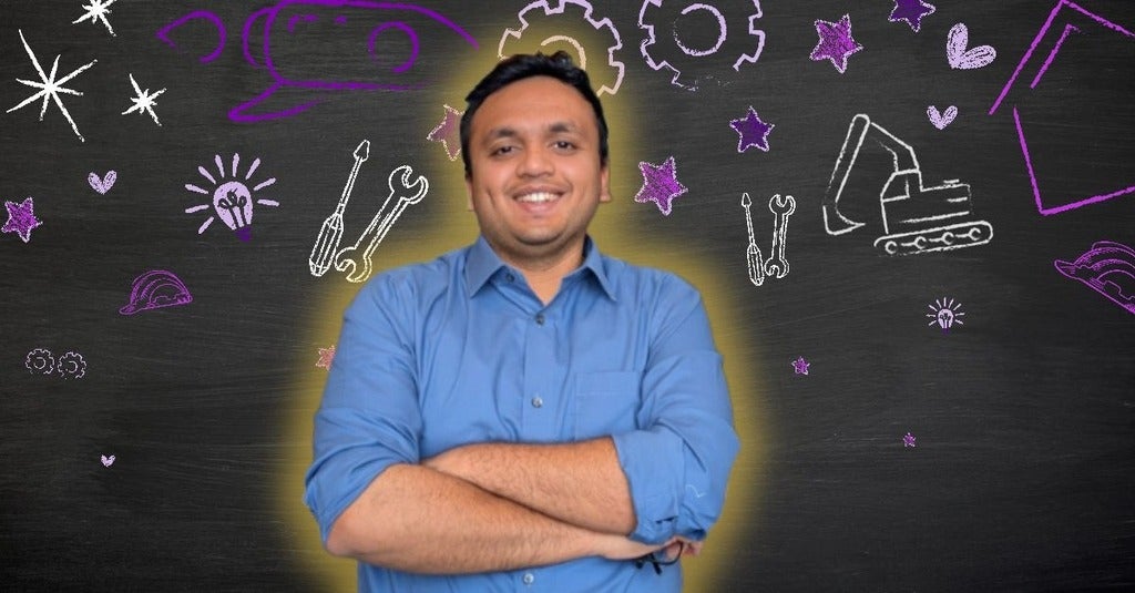 Dhruvil posing in front of Engineering icons