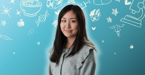 Christina Yang posing in front of health related icons