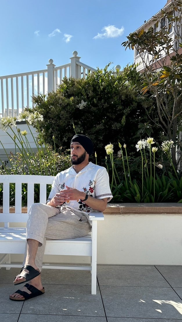 Jaskaran posing on a bench 