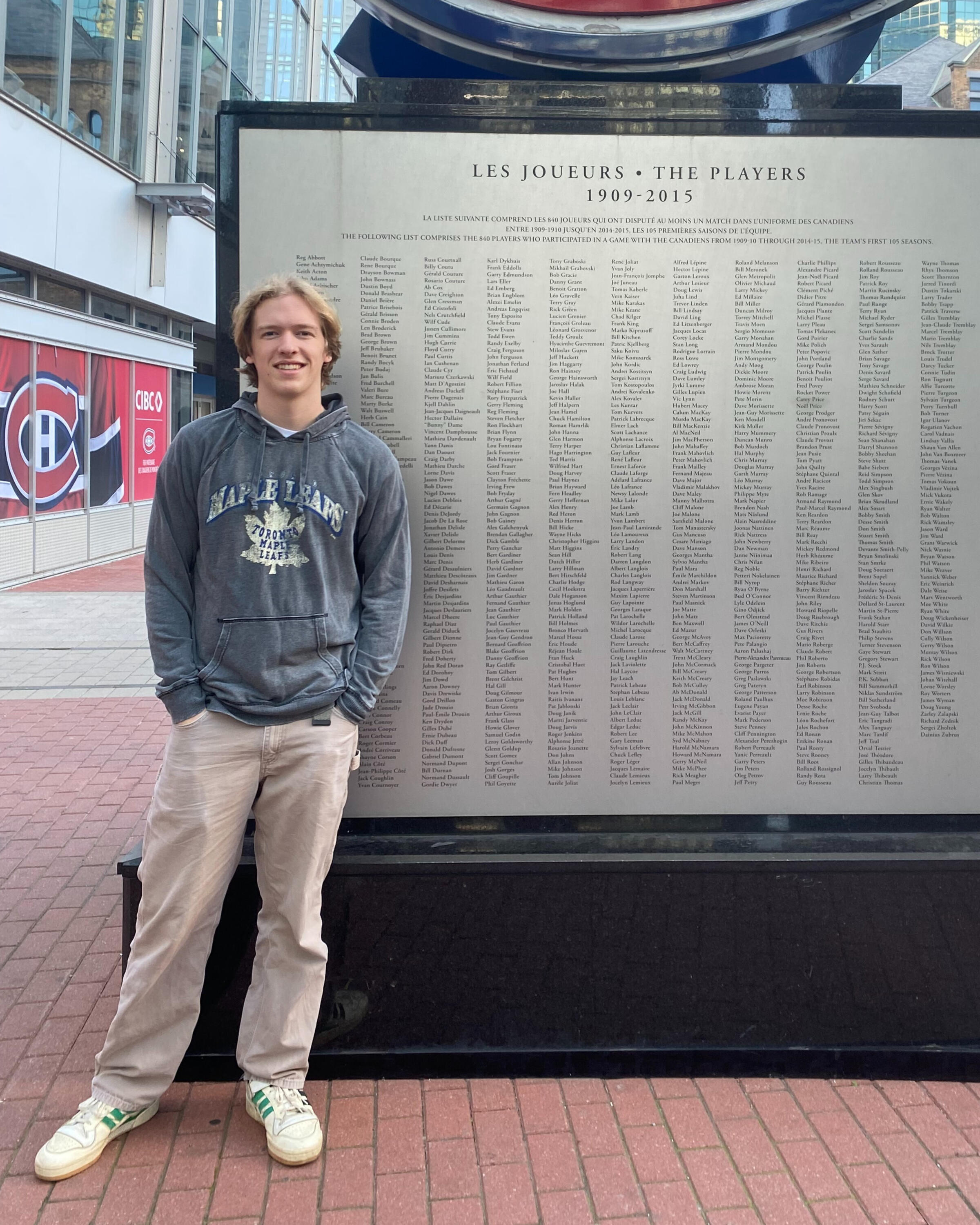 Luke posing in front of a board in Montreal