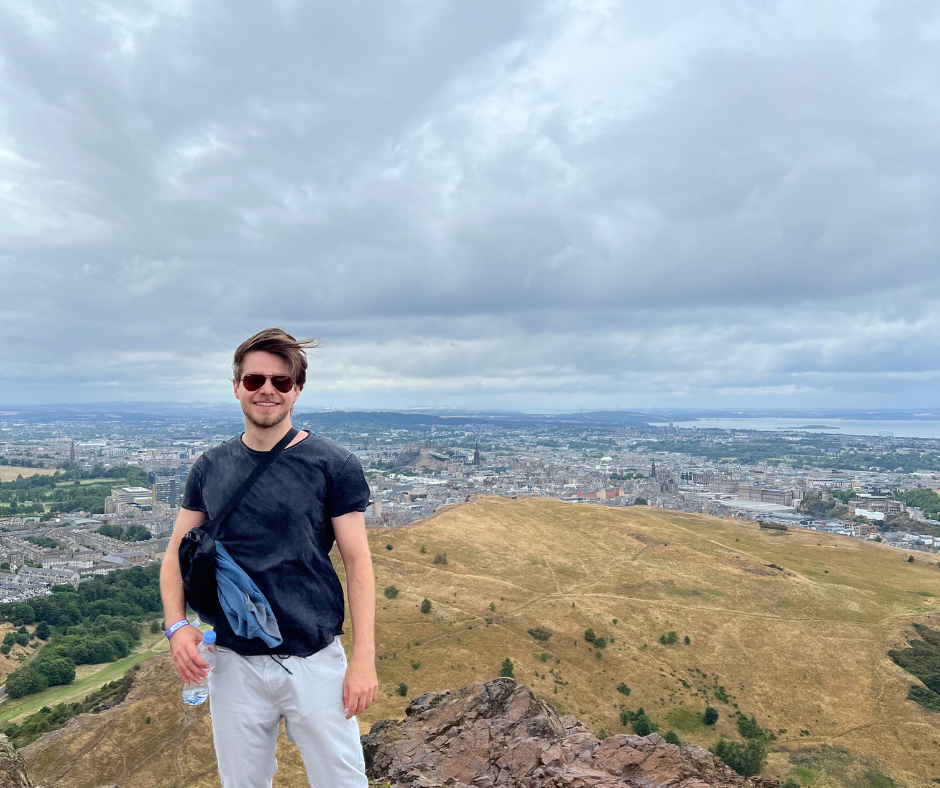 Stefan standing in front of a panoramic view