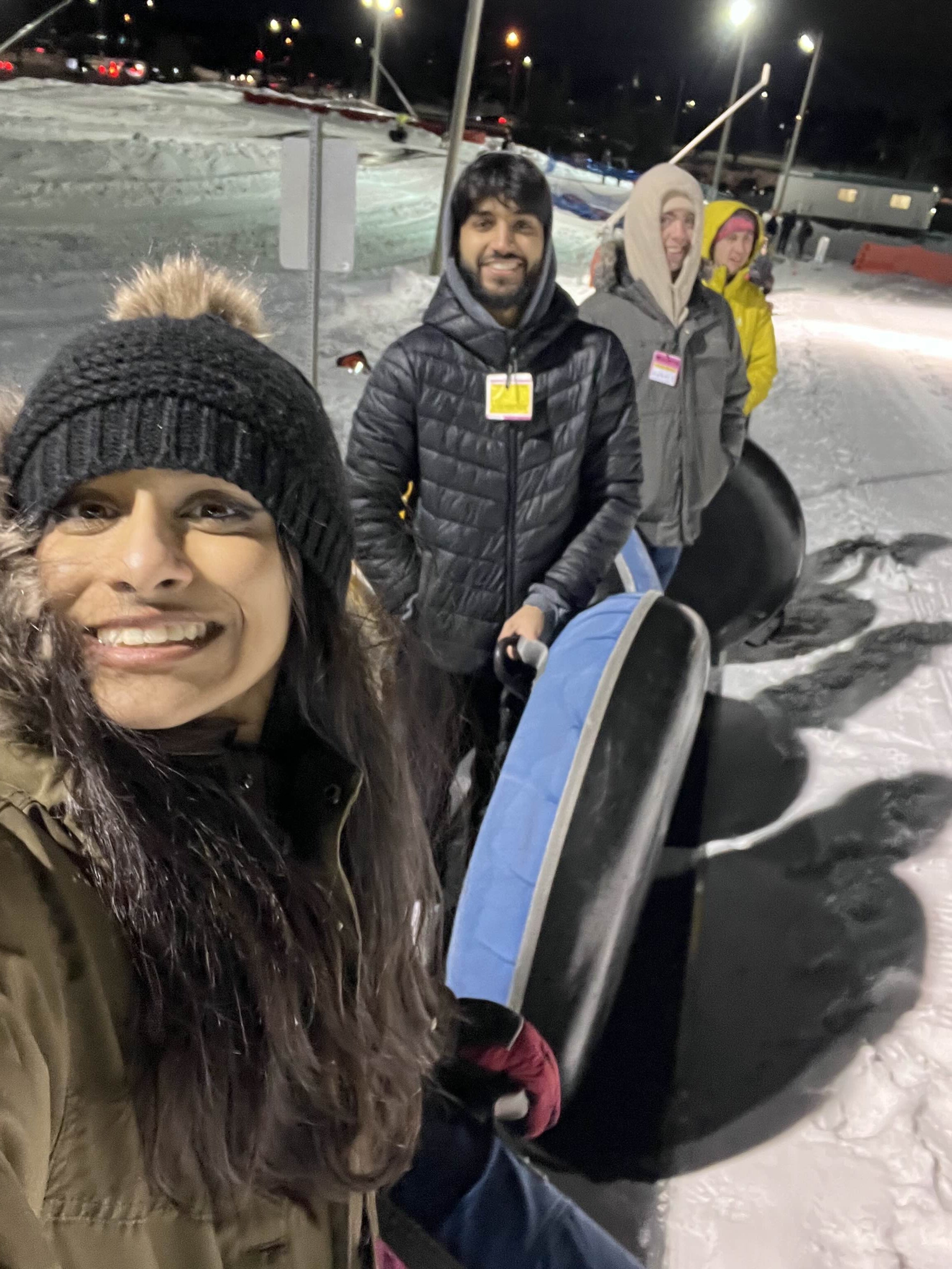 students posing with snowboarding gear 