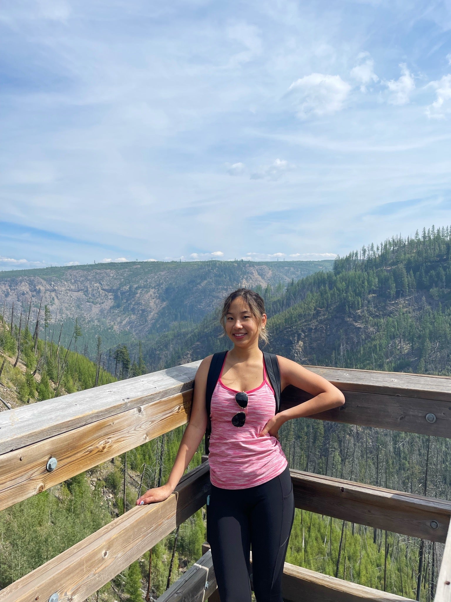 Daisy Shuyi Xiao posing at the top of a mountain during a hike