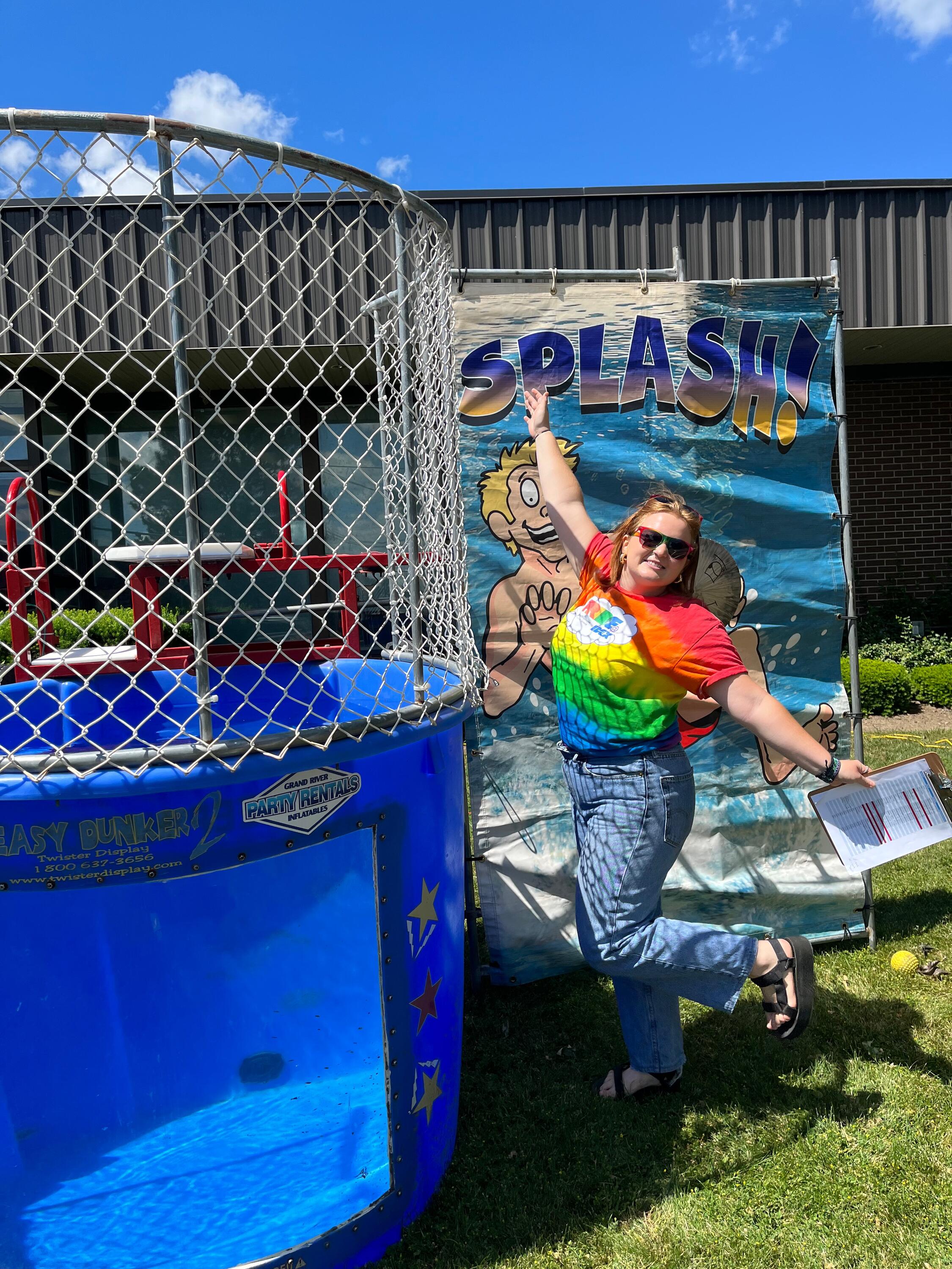 Aisley Ellis standing beside a dunk tank.