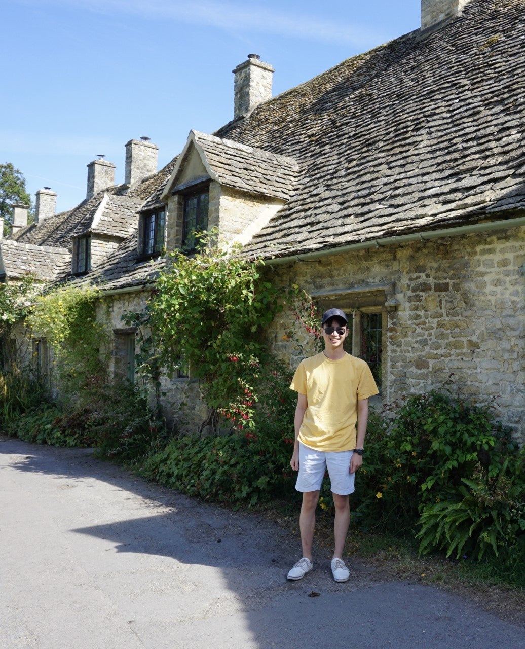 Alex standing in front of a building 