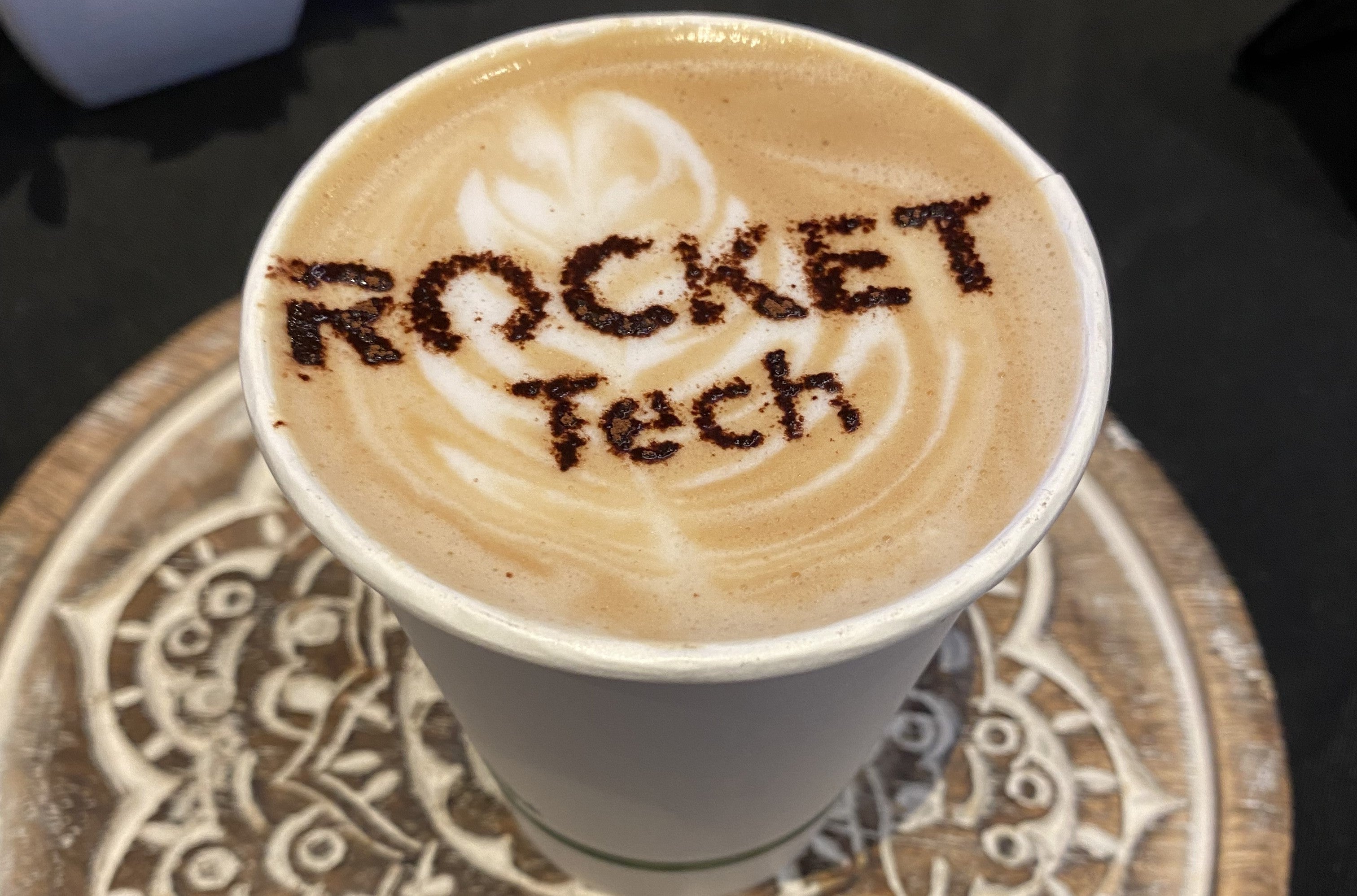 A coffee with Rocket Tech written on it.