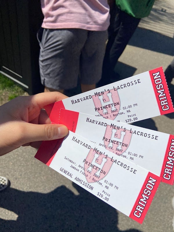 A photo of three tickets reading "Harvard Men's Lacross vs Princeton."