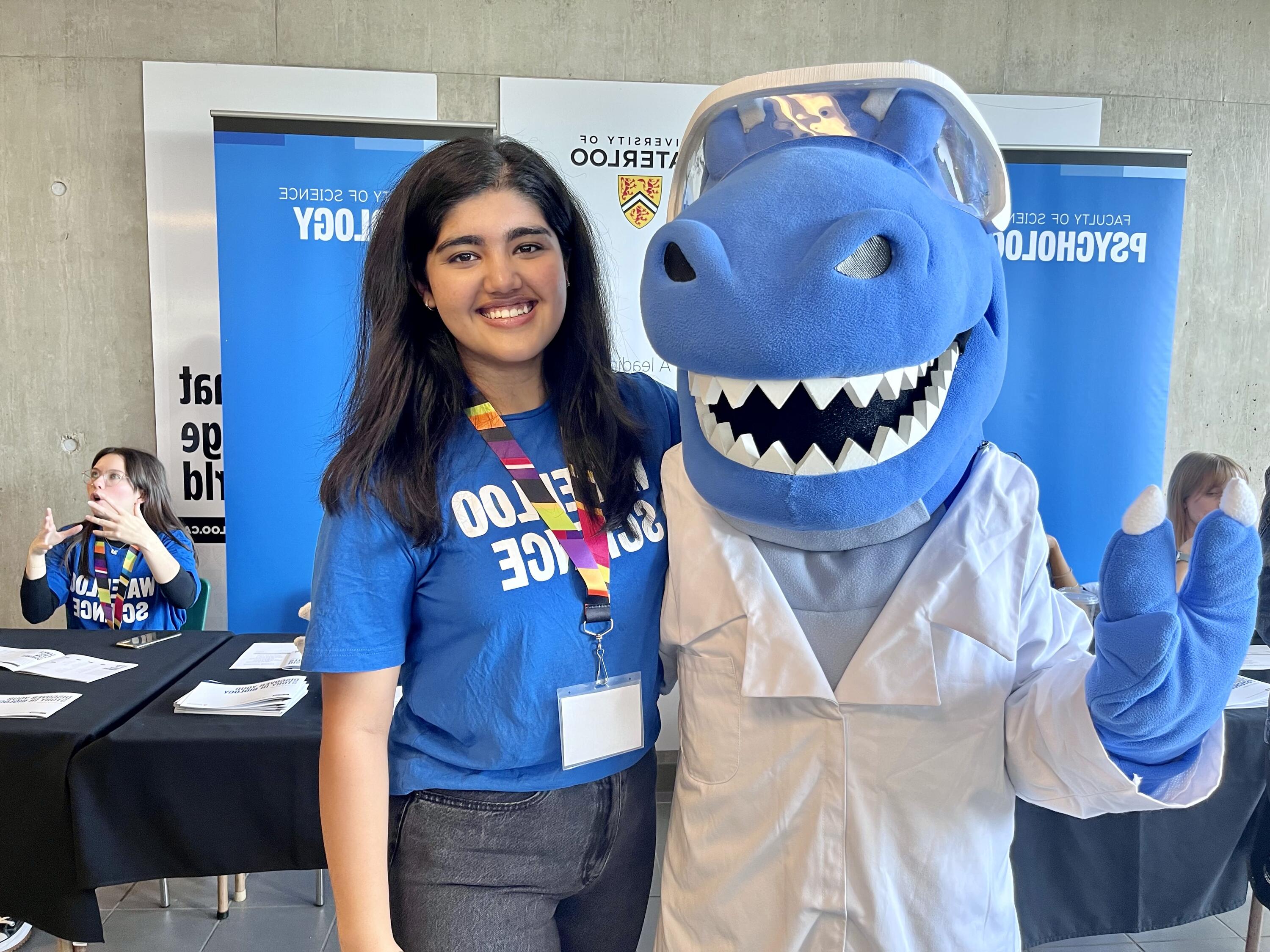 An image of Prakriti and a blue mascot 