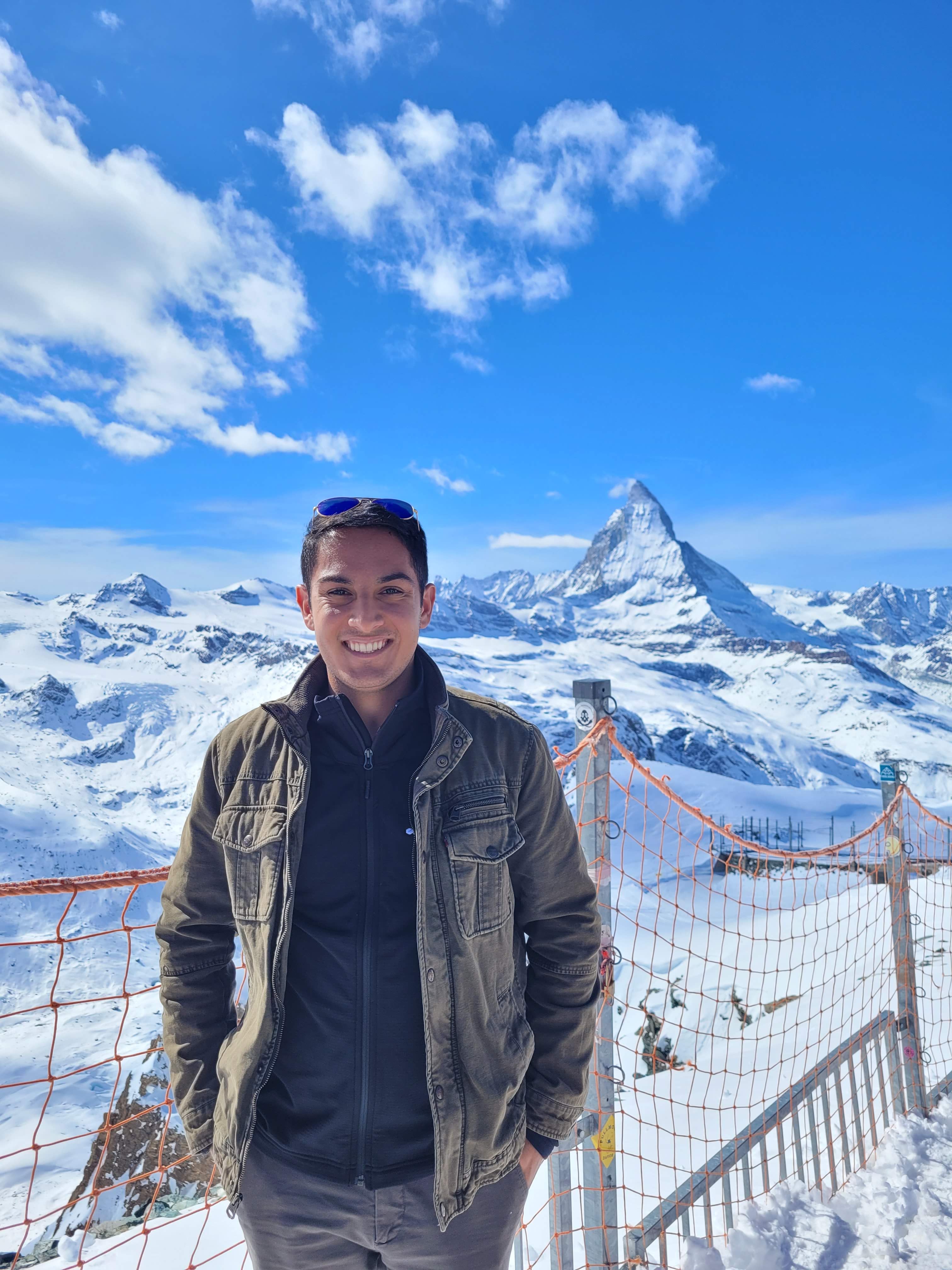 Jason standing on snowy mountain.