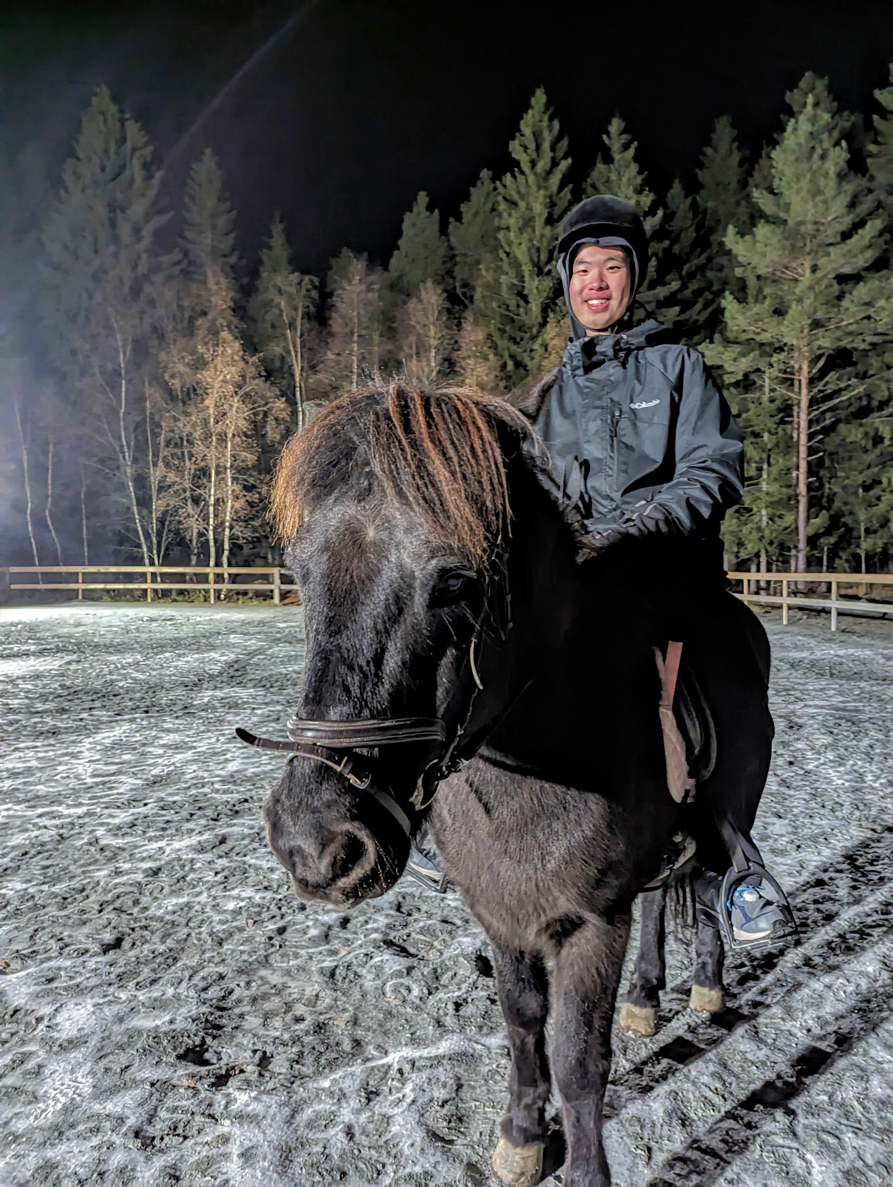 Raymond riding a horse.